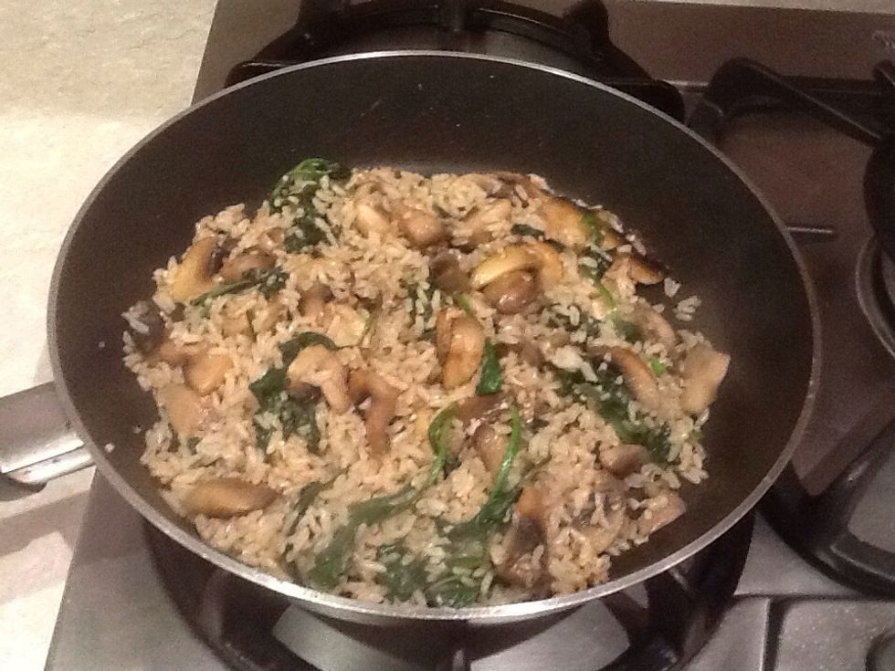 This is the finished product of brown rice, mushroom and Spinich.