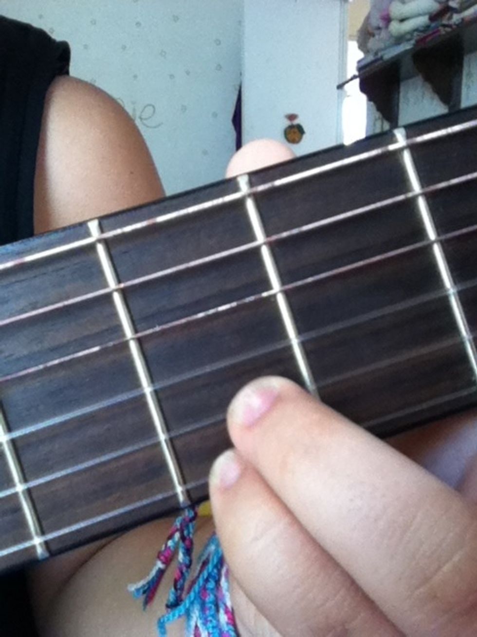 This is the fourth chord. You take off the index and middle fingers and play the 6th and 3rd strings at zero. (without the capo would be at 2nd)