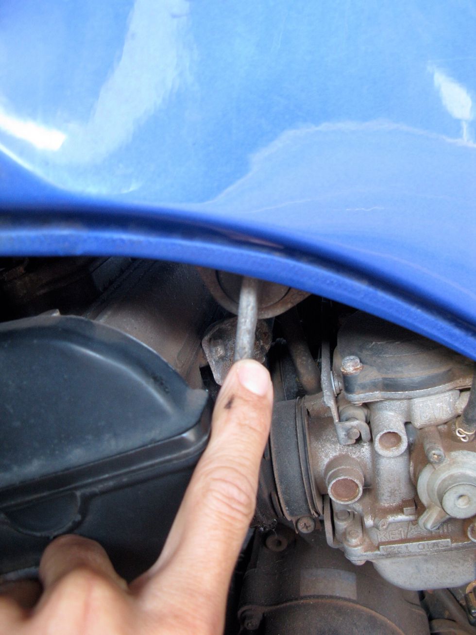 This is the fuel pitcock. Turn it to the right and off position so fuel won't spill anywhere.