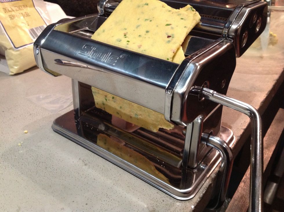 This is the fun part!!! You get to crank the dough through the machine a whole bunch. Do it in batches of about 1/3 at a time. Keep the remaining dough covered in the bowl with a damp cloth.