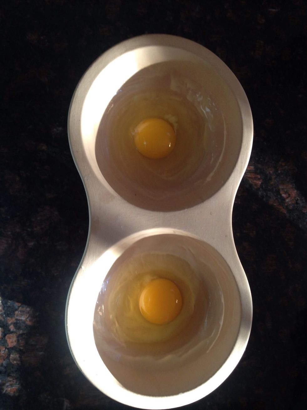 This is the "key" to 2 minute egg Sammie's : The Pampered Chef Microwave Egg Maker. Put a dab of melted butter in each well, then add 1 egg to each.