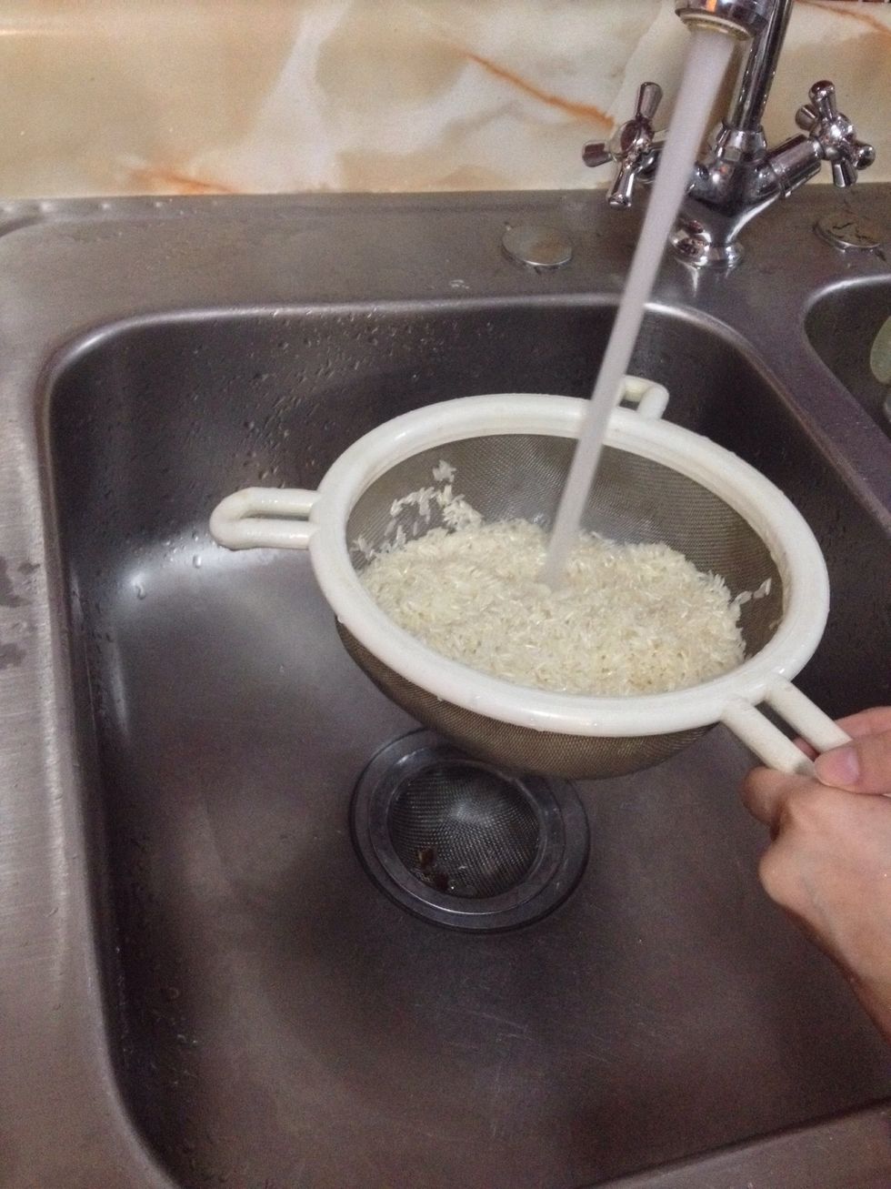 This is the most important part: Wash the rice! Place the rice in a strainer and let cool water go through it..