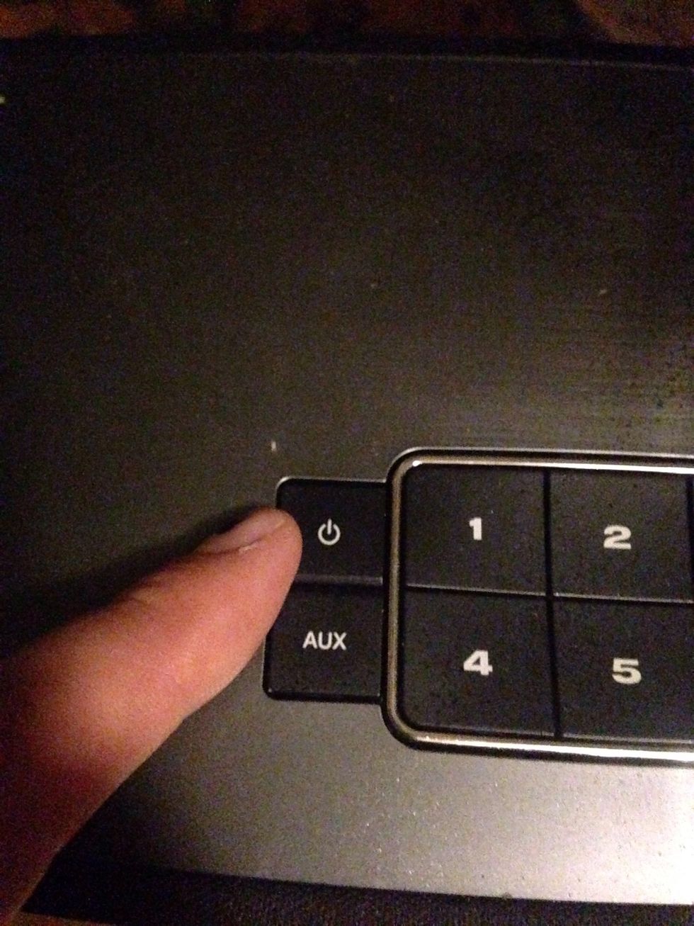 This is the "On" and "Off" button for the BOSE speaker