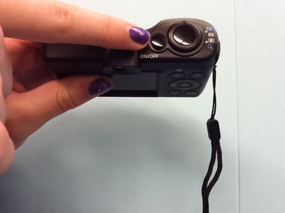 This is the on and off button. Press it once.