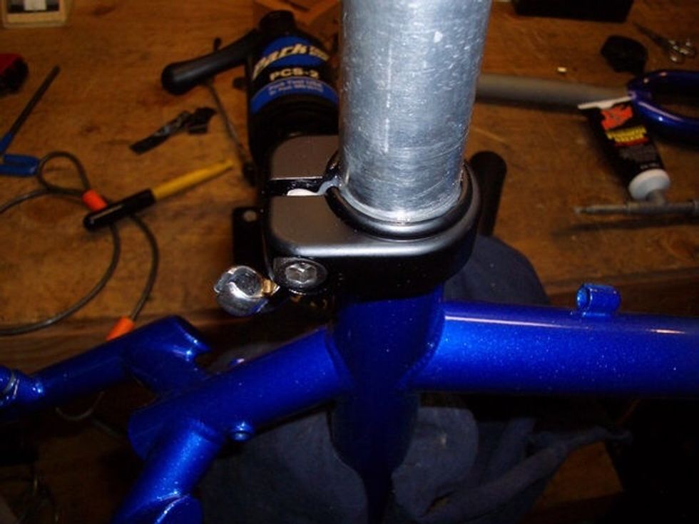 This is the part you add the seat post and clamp on. You can see the seat post and the seat clamp.