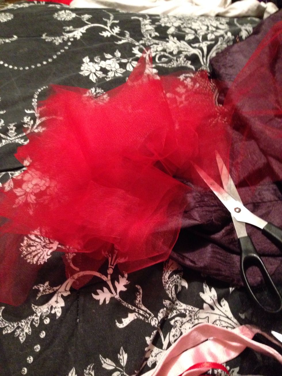 This is the red tulle after I cut it into the strips. Make sure to double the length that your wanting... BIG HELP FOLD THE TULLE AS MANY TIMES AS YOU CAN OR WANT TO MAKE EASIER CLEANER CUTS!!!