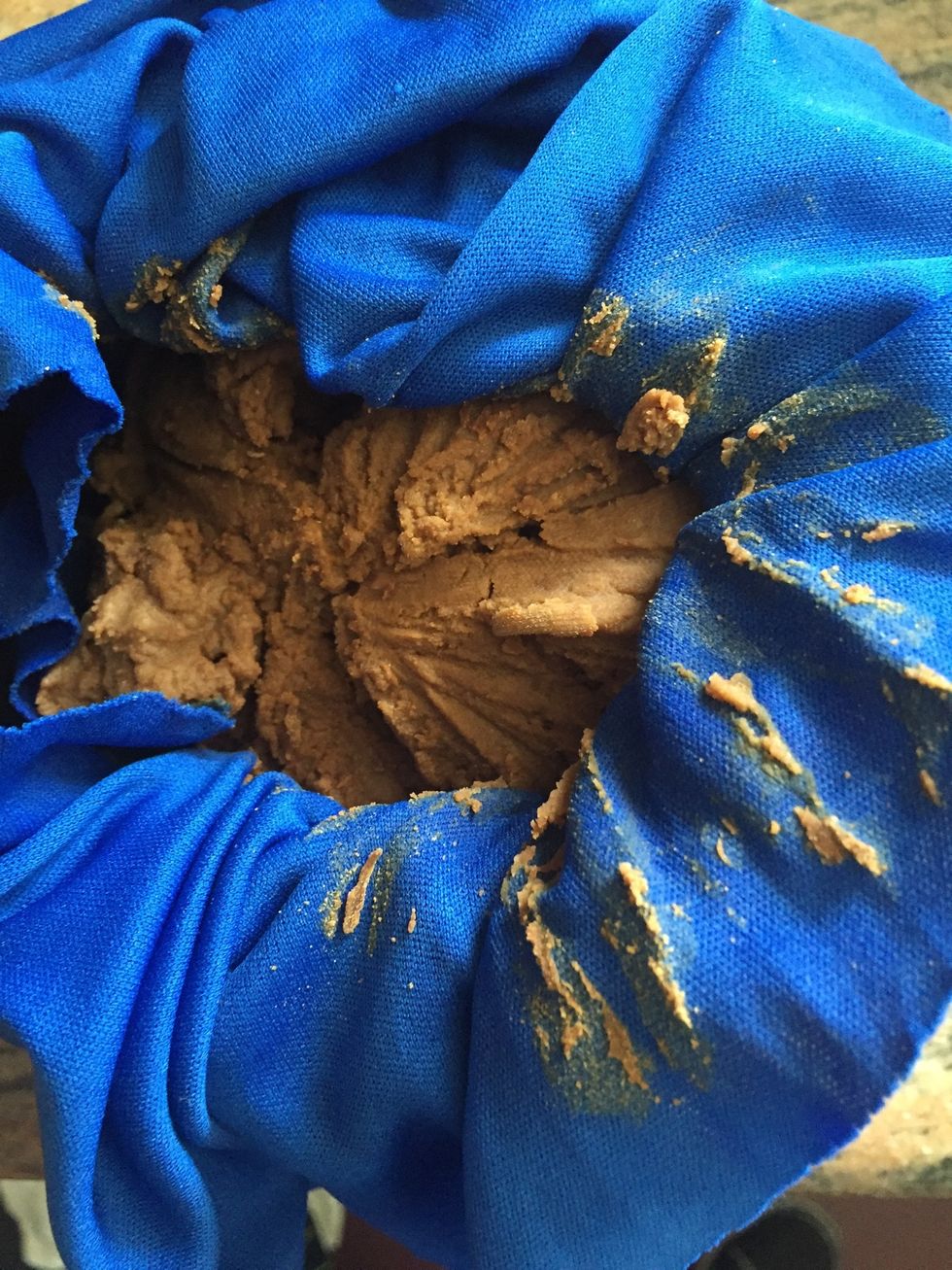 This is the residue which is very saturated with ghee. The best way to get it out is to put remove it and put it in a pot and pour boiling hot water over it. Let that cool and put that in the fridge.