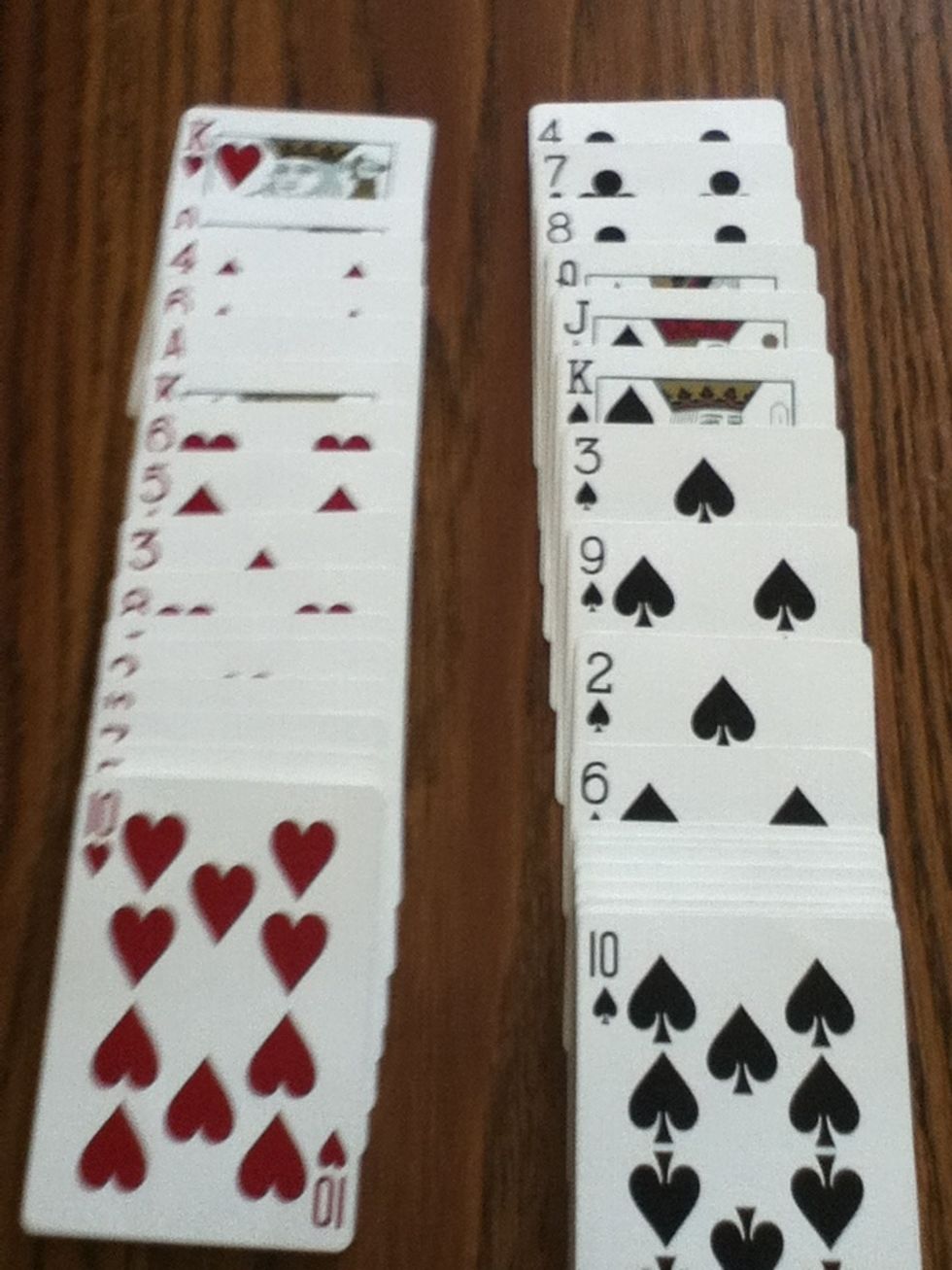 This is the set up; you take all the red put it It in one pile and the blacks in a different pile.