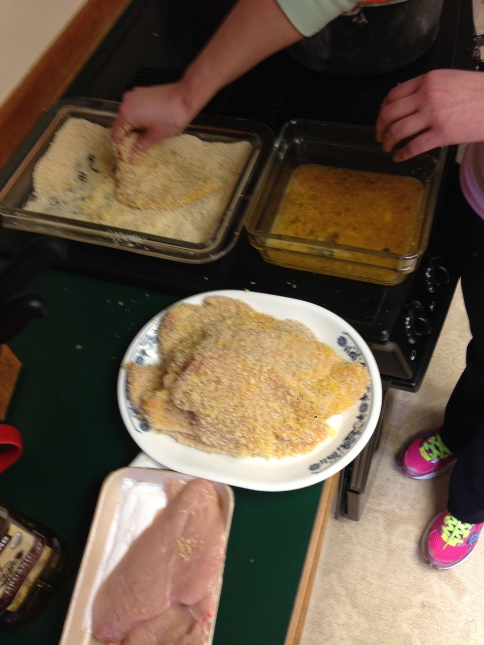 This is the setup you want - chicken, Pyrex with egg batter, dish of bread crumbs, plate to put the breaded chicken