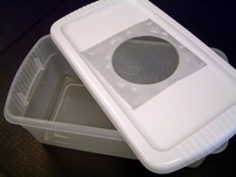 This is the simple plastic container. It is made from a plastic tote and chicken wire. It is very easy to make.You cut a circle in the middle of the lid and then you hot glue the chicken wire over it.