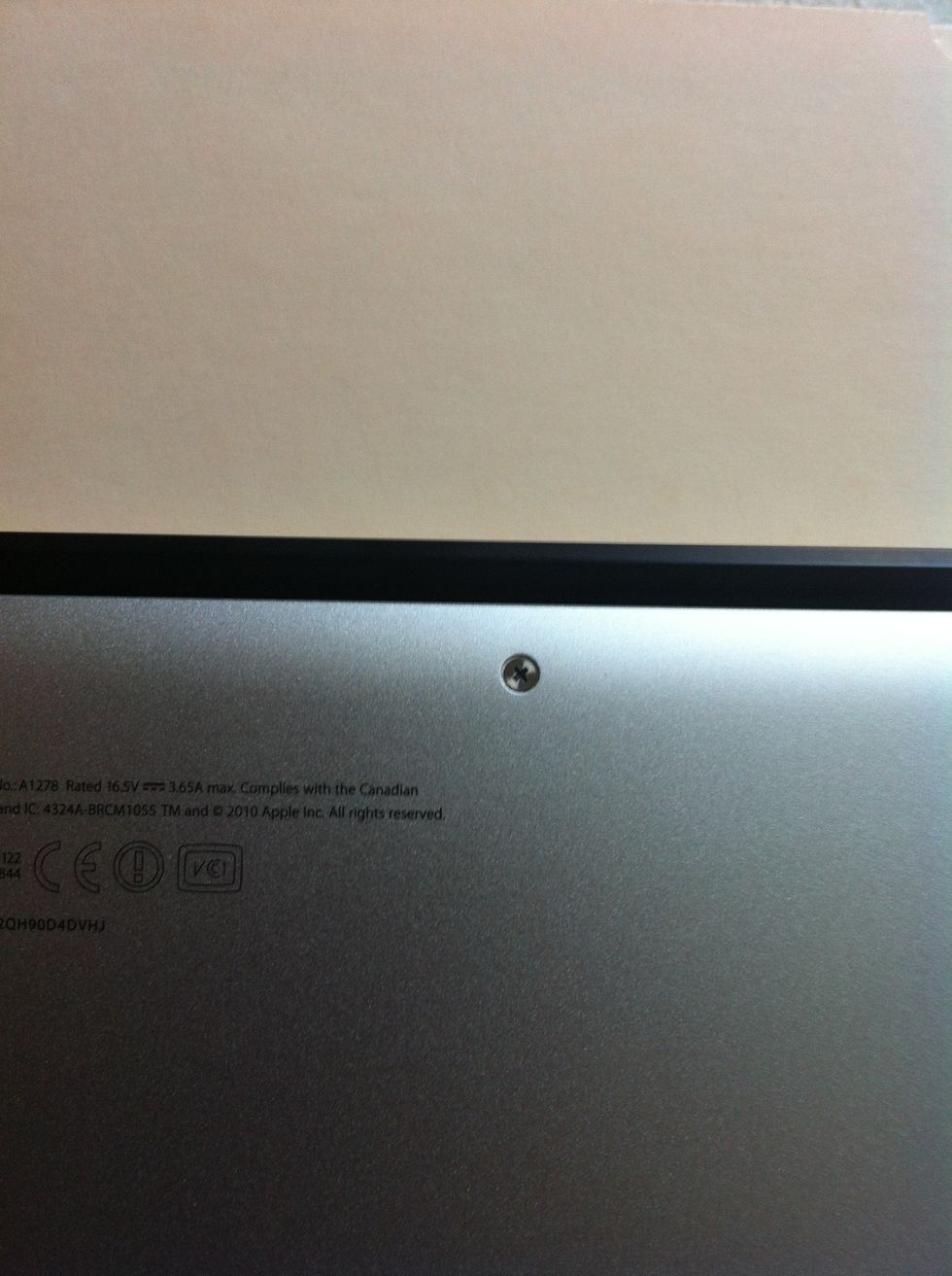 This is the single screw on the MacBook pro