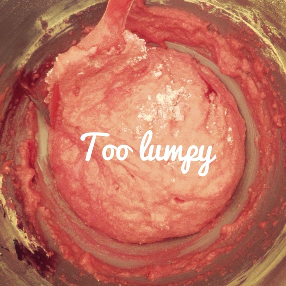 This is the tough bit, you don't want to over mix or under mix so give it about 60 'folds'. This shows it too lumpy still and the macarons will crack in the oven.