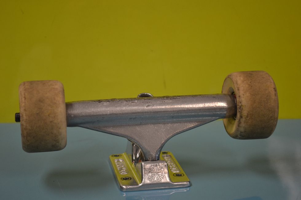 This is the trucks with the wheels on them.