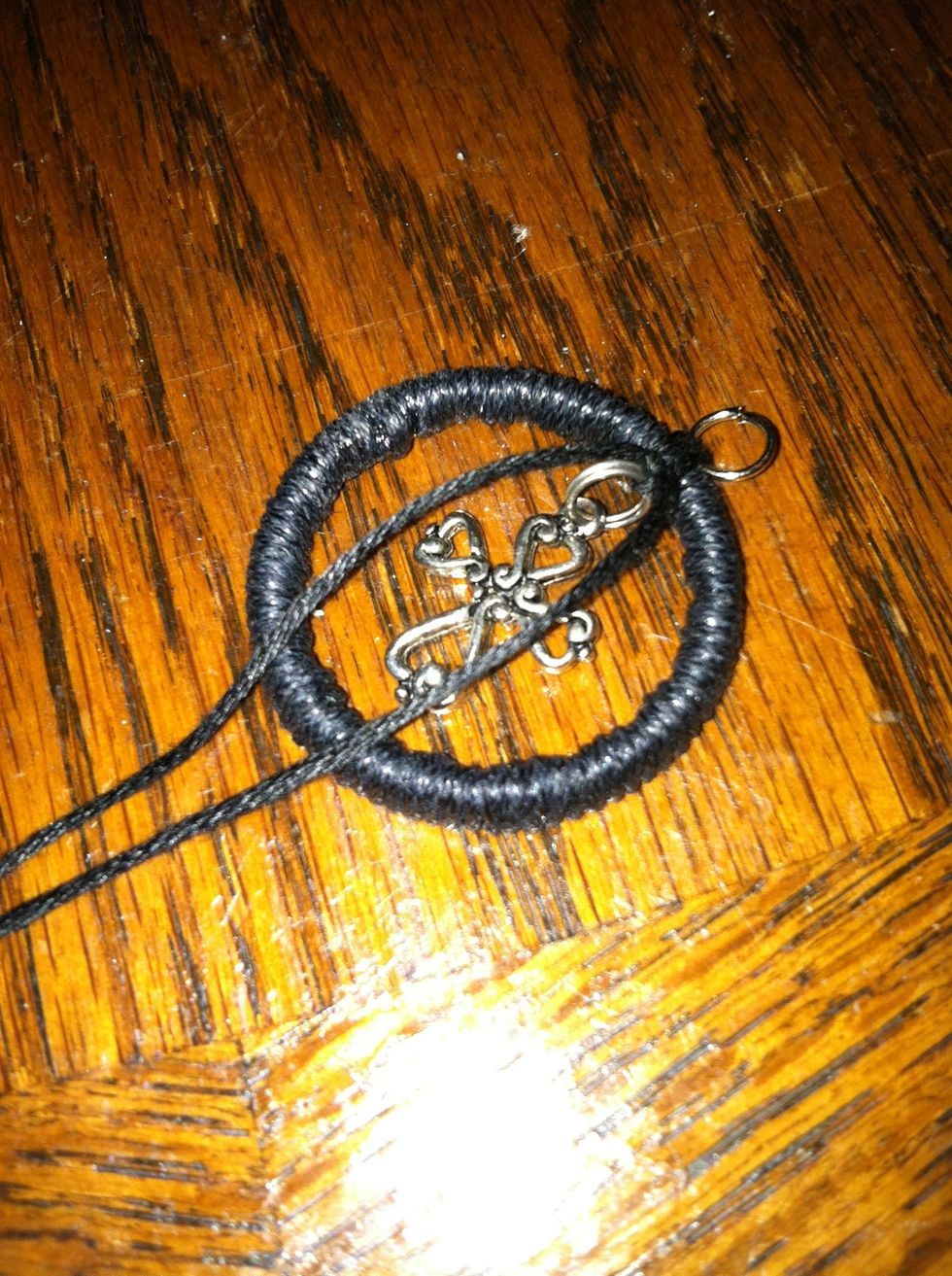 This is the view from the back. I also tied a standard knot to add strength. The strings should go down like the charm and the jump ring up. You may need to flip your LH knot as you tighten it.