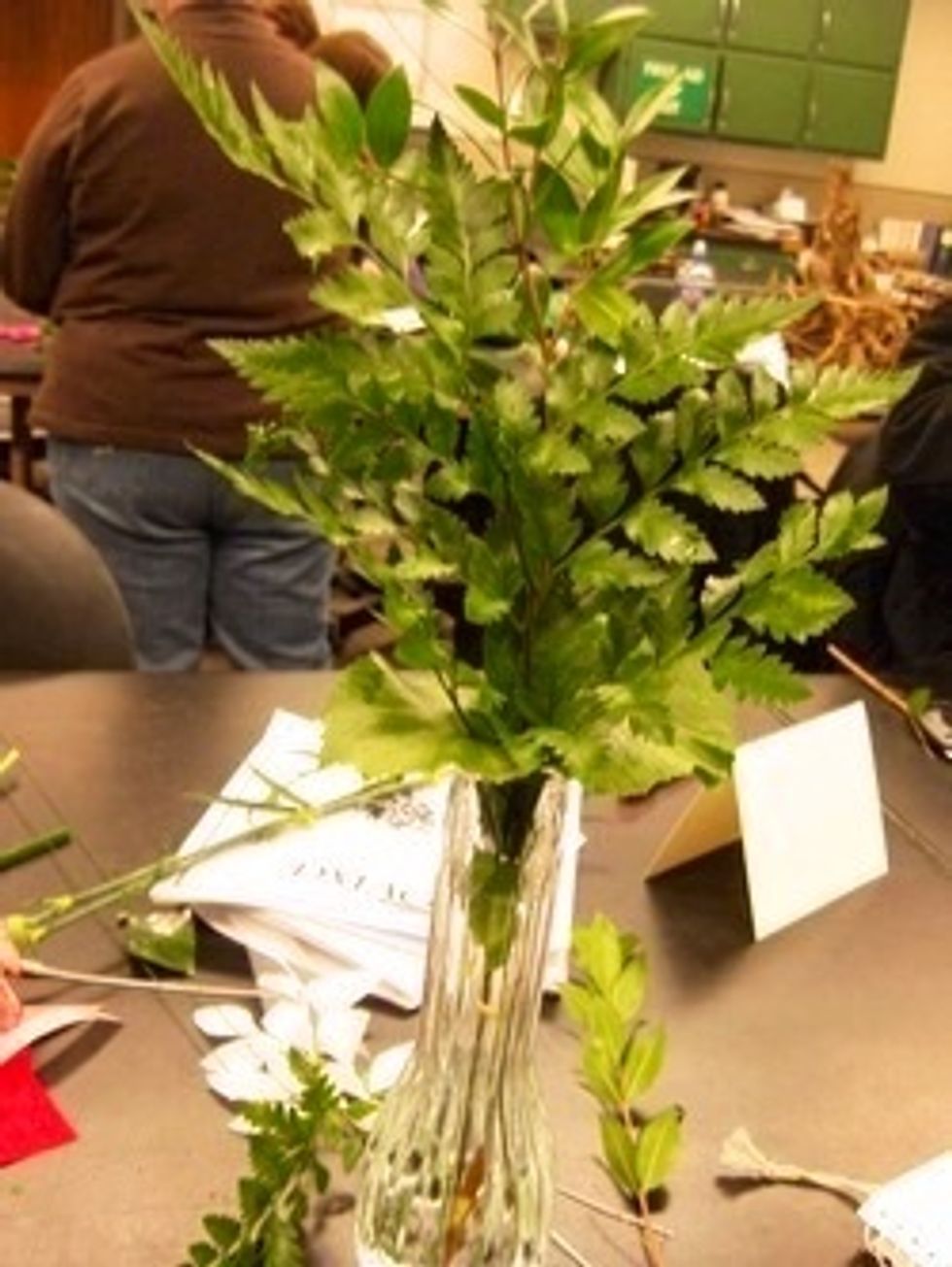 This is the wiped off leather leaf. The leather leaf should be 1 and one half the size of the vase in order to achieve proper proportion. A second piece of leather leaf should be added (back to back).