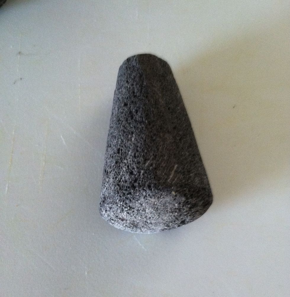 This is used to grind the rice against the surface to remove the grit and smoothen bowl