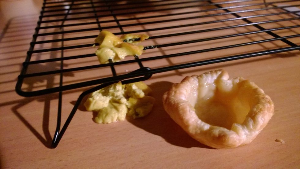 This is what happens if you handle hot egg tarts. You fumble and drop them right on the cooling tray. Place the cooked egg tarts on the cooling tray immediately to avoid soggy pastry.