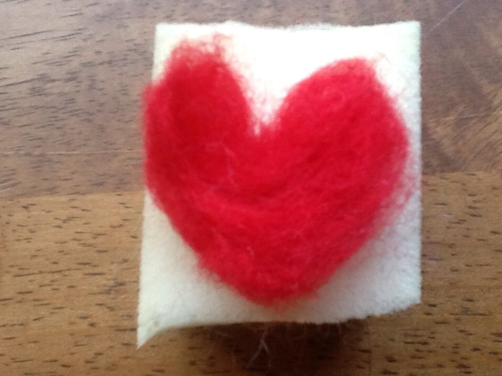 This is what it looks like after a bit of felting, now holding its shape on its own and starting to look like a heart