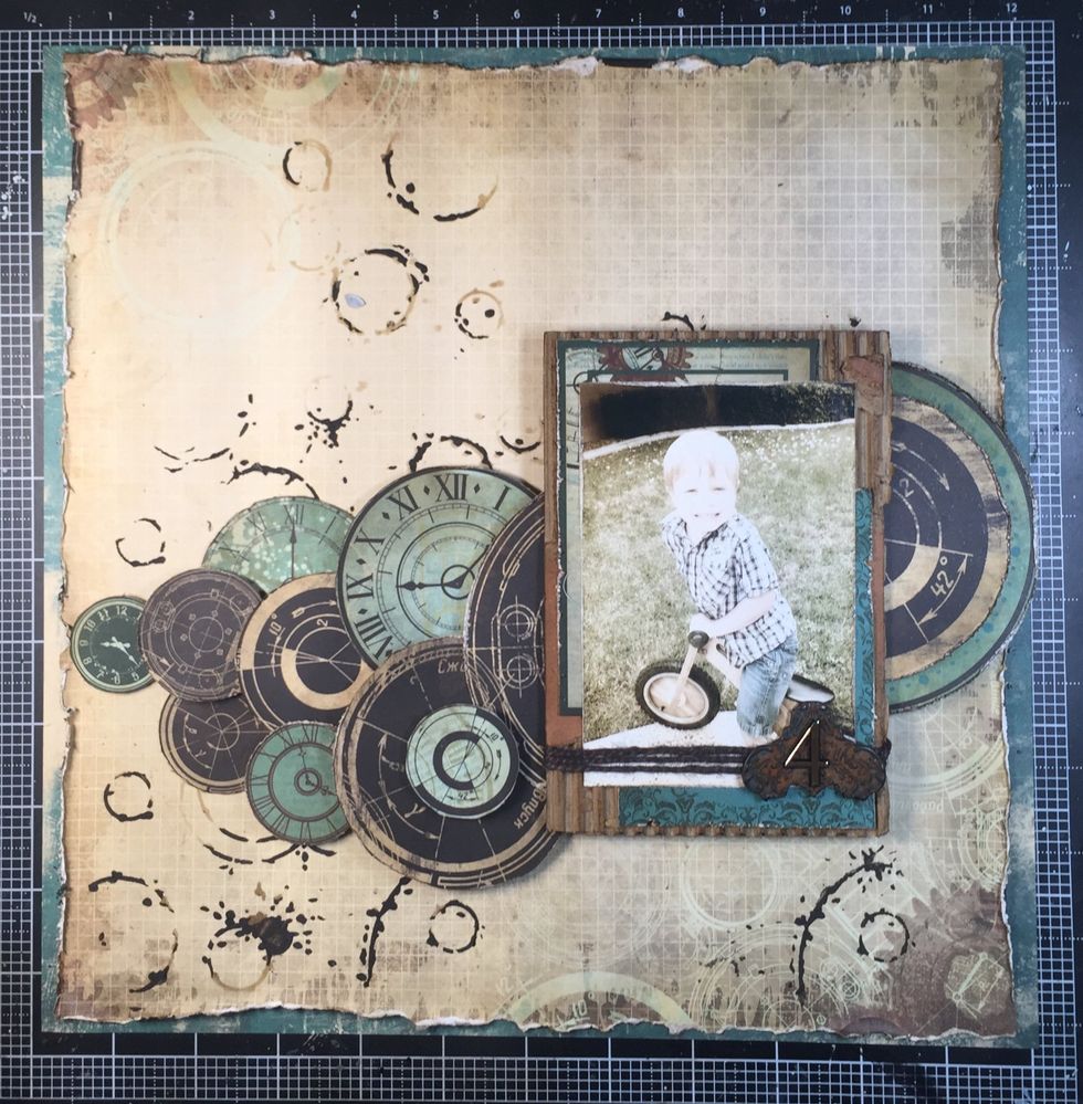 This is what it looks like so far. I still need to add the rest of my circles in the top left, and I want to add some die cuts to round out the design.