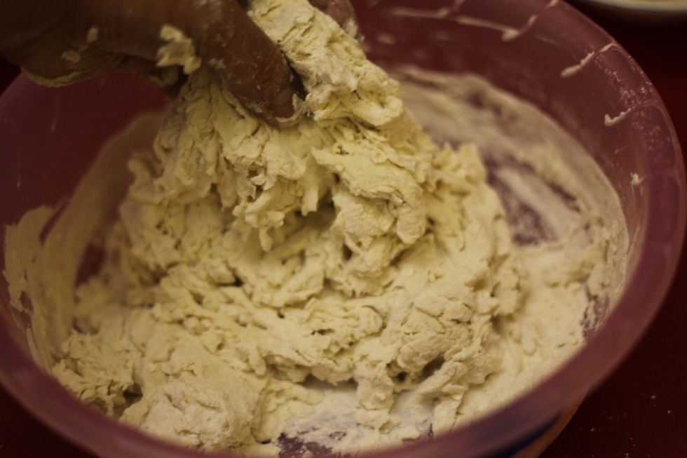 This is what it looks like so far. So we need to make sure no more flour is stuck in the bowl. That's when we know it's ready. So let's keep going.