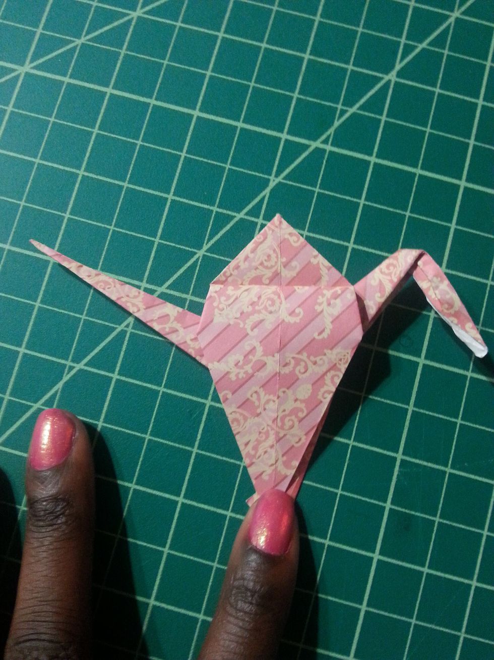 This is what our crane will look like with both flaps folded down. This is the second to last step.