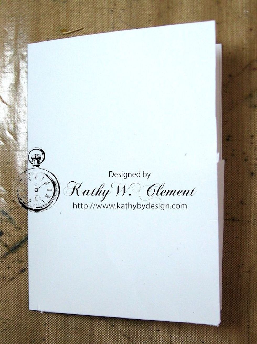 This is what the base looks like when all folded. The crease is on the left, the opening on the right. Crease all the folds and trim up any uneven edges before you proceed to the next step.