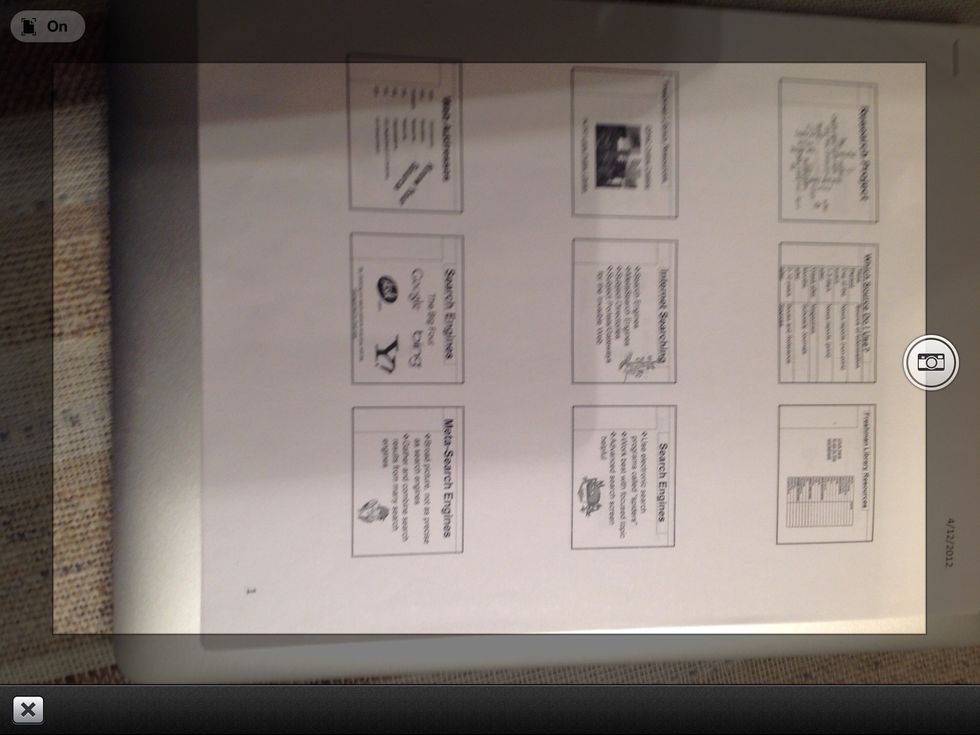 This is what you'll view when taking a picture of a document. Center and then touch the camera.