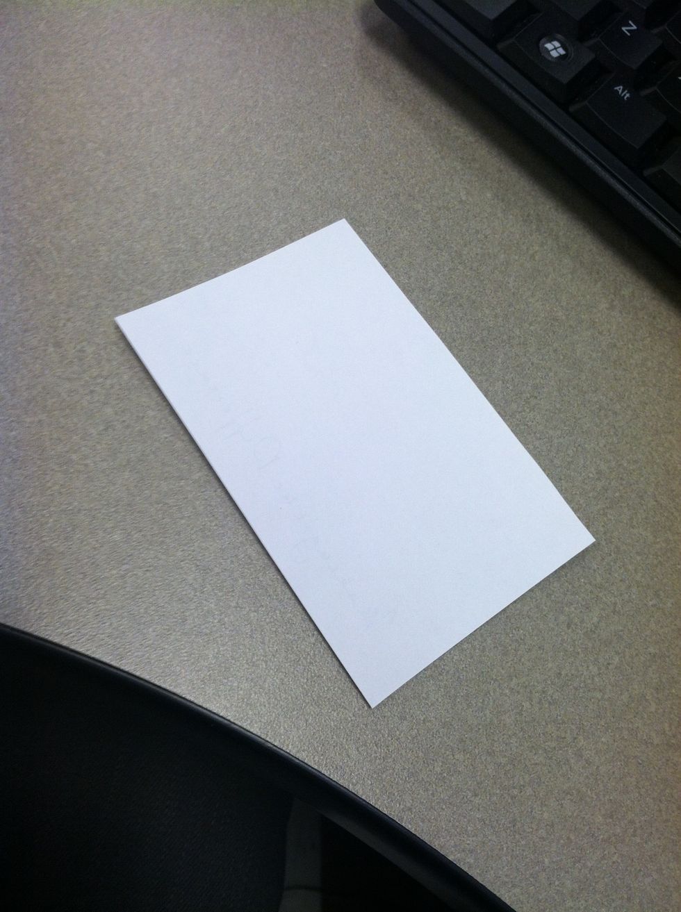 This is what you start with. Cut a piece of paper to be roughly the shape of an index card. You can use full sheets of paper if you want a bigger frog. The shape is what's important.