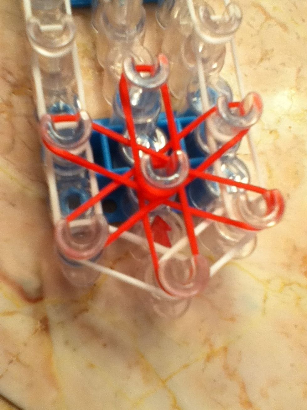 This is what your flower should look like when your done. Push the middle peg down so the bands don't get bunched up. GOING COUNTER CLOCK WISE IS VERY IMPORTANT!