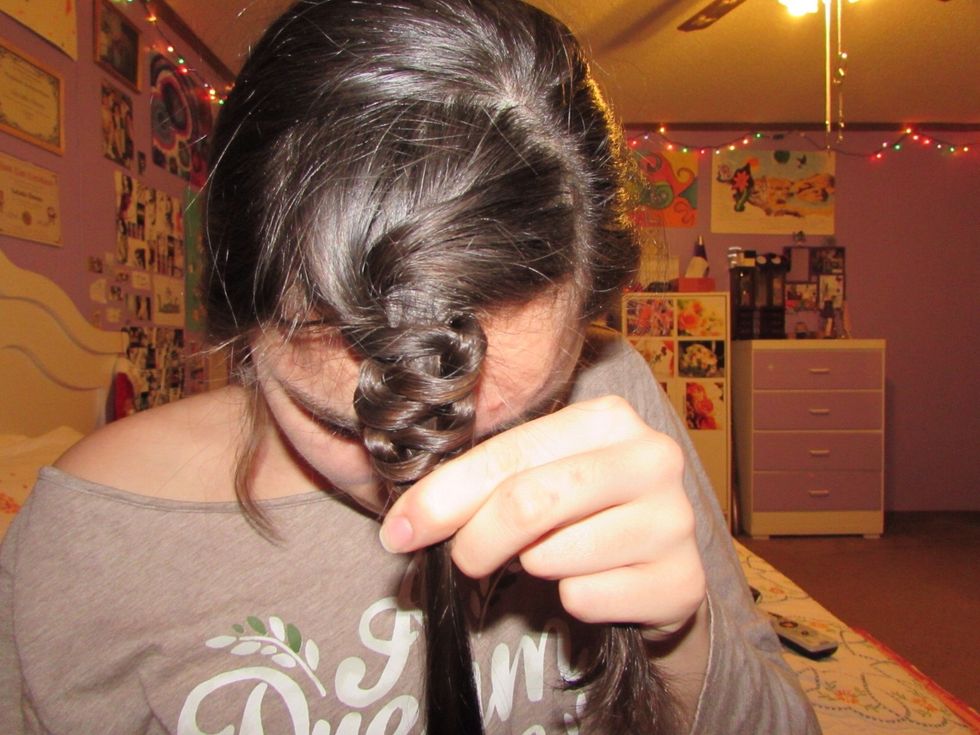 This is what your hair should look like once you have pushed the two strands all the way up to your head.