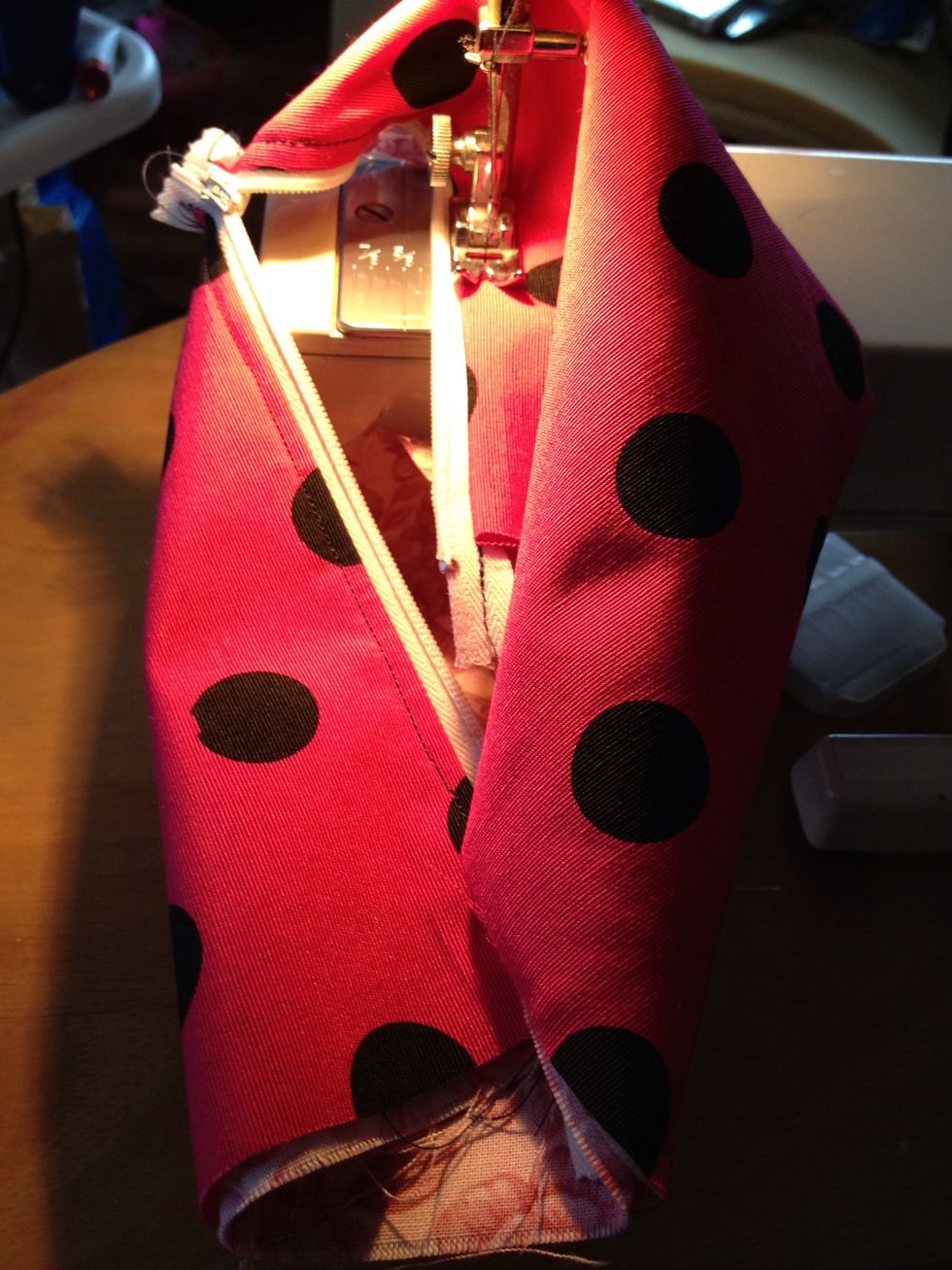 This is where it gets tight, slow and finicky. If the zipper doesn't separate at the end, youll have to be careful sewing the top seam. Making sure you don't sew another piece along with it.