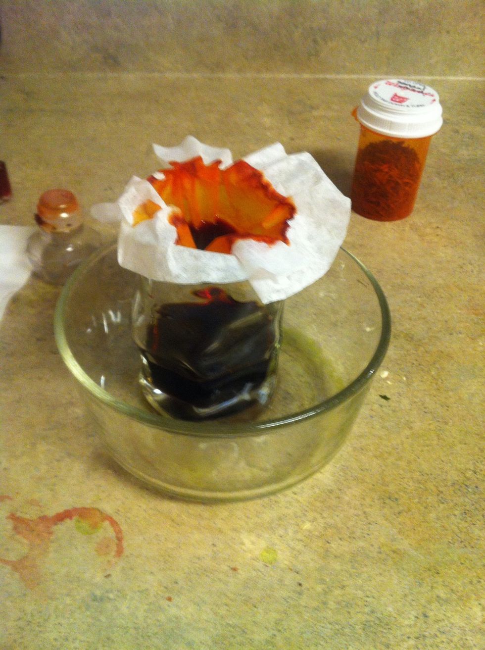 This is where patience is needed; it may take up to 30 minutes for all of the liquid to get through the filter because it drips so slowly, and you can't do it all at once. Just let it do it's thing.