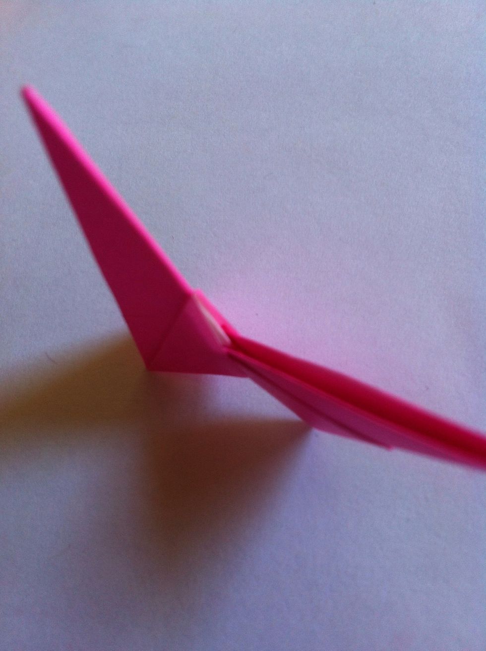 This is where you'll use those pockets. Slide one origami part into the other as shown.