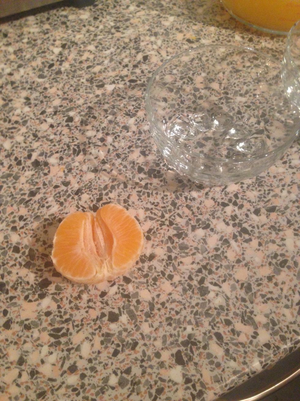 This is why we kept one back,peel the orange and place 3 pieces into each the bowl.