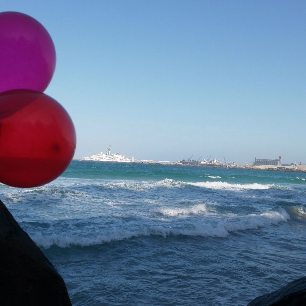 This is working together because I was taking the photo and my friend was holding two balloons this at Nuns beach.