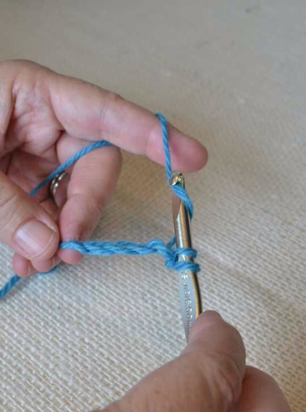 This is your first single crochet stitch. Repeat for the next V until you end the row.