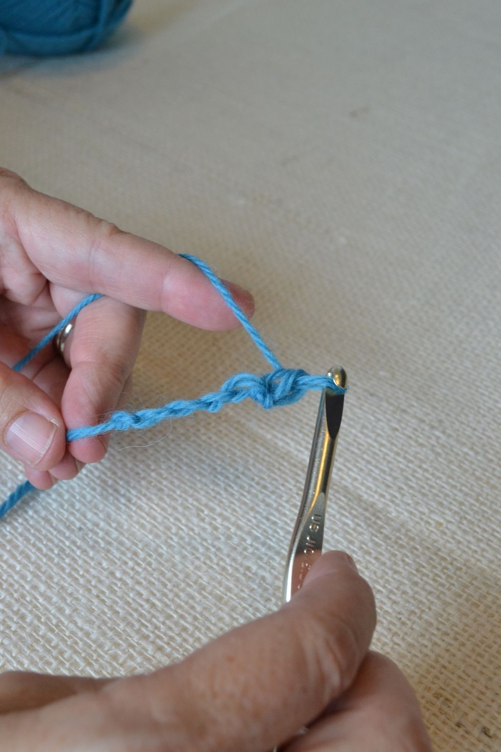 This is your first single crochet stitch. Repeat for the next V until you end the row.