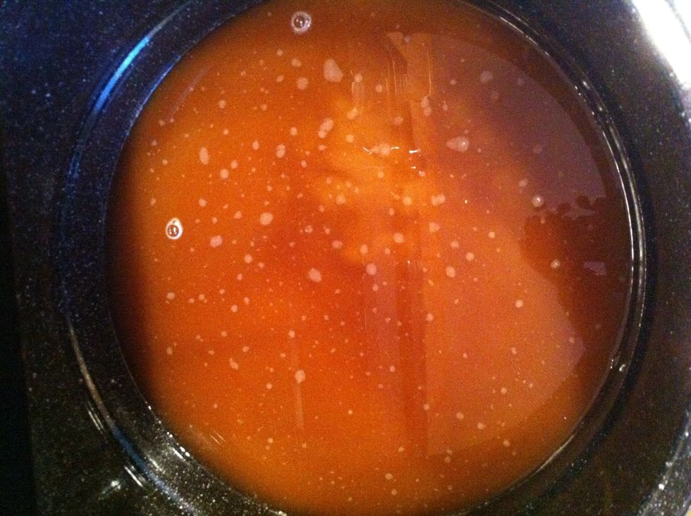 This is your wort. Turn the burner back on and bring this solution close to boiling. you will be able to hear the water start to boil. DON'T boil the solution baby boy!