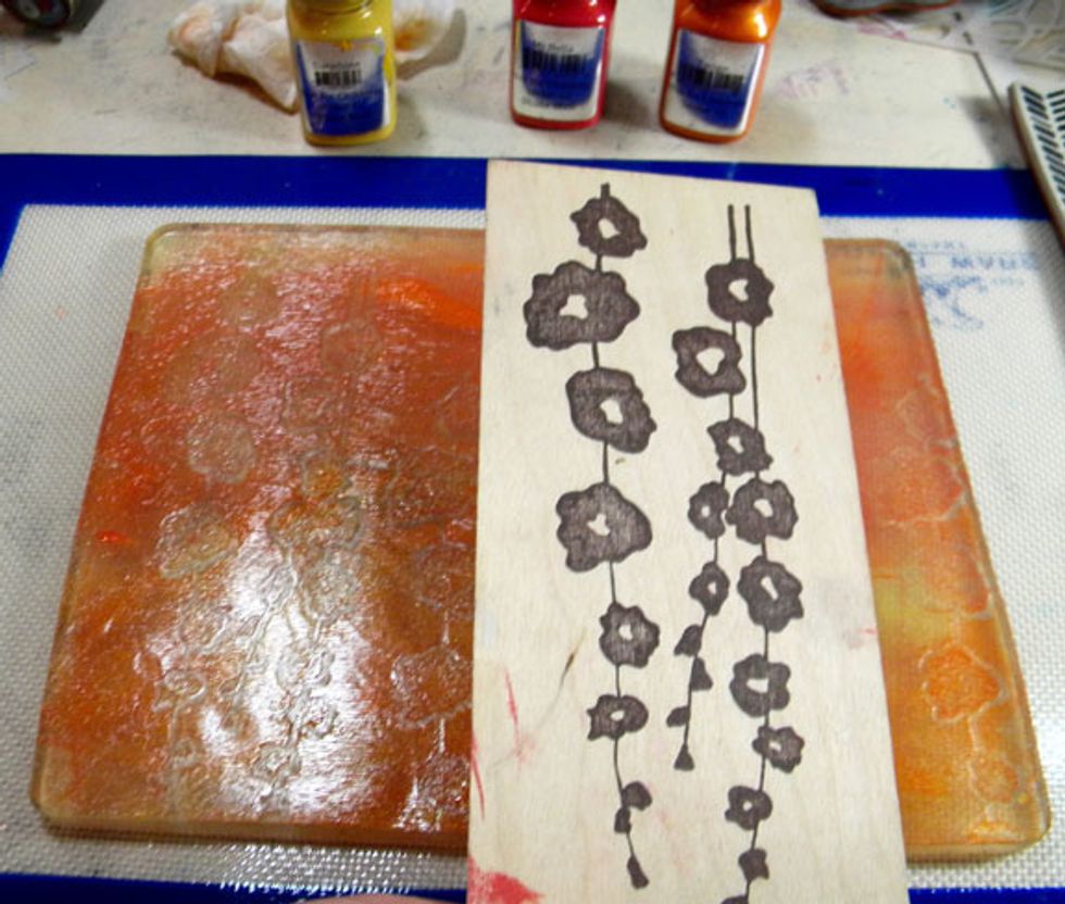 This large stamp is perfect to use on the Gelli Plate.  This time I mixed three different colors and stamped into the plate in the same direction, but altering the height of the flowers.
