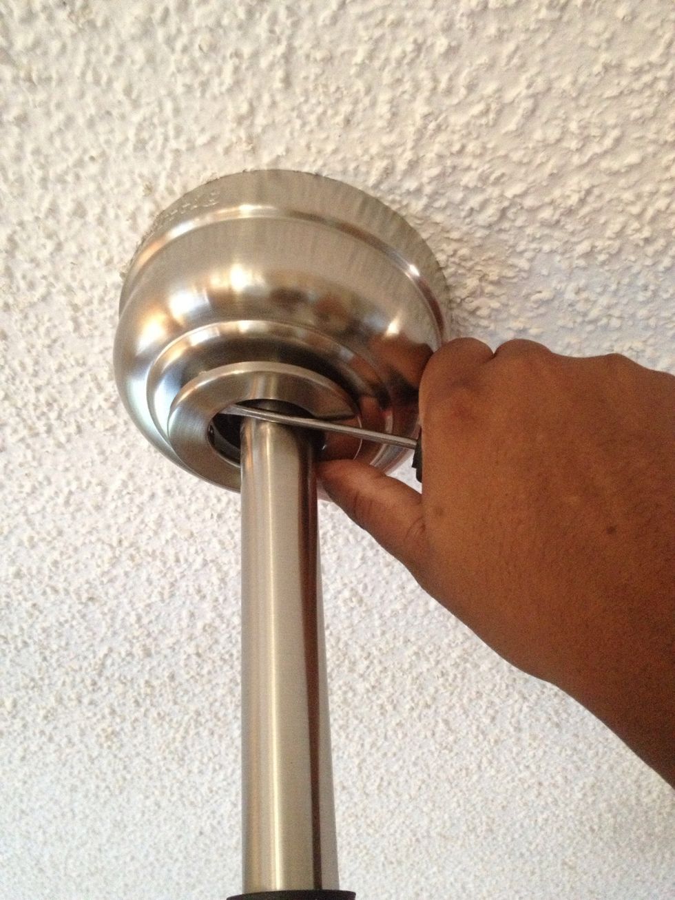 This little cover pops off, yours may screw off, just be careful so you don't damage anything