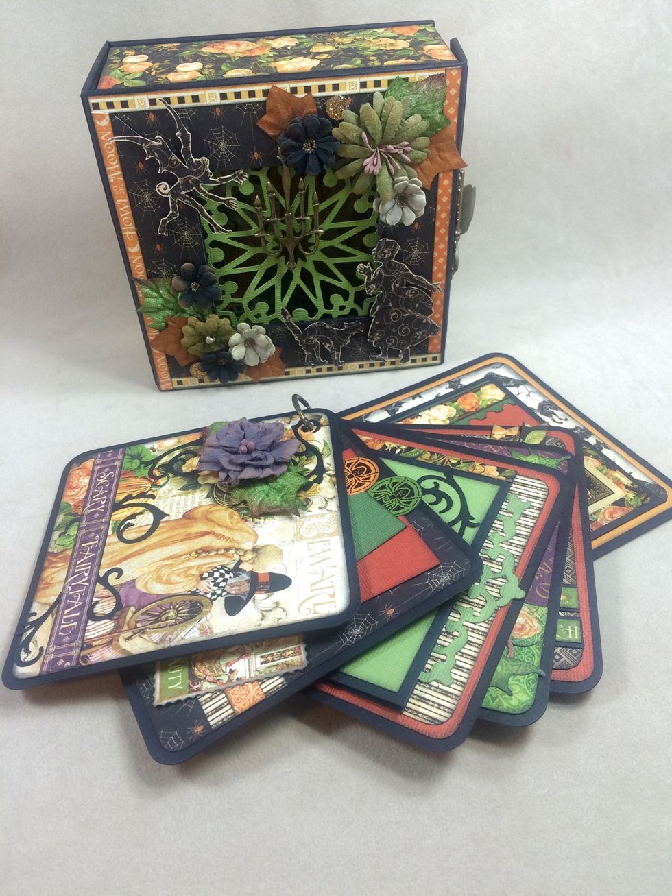 This little Halloween mixed media box has a fun, interactive mini album that fits inside. A great holiday home decor piece.