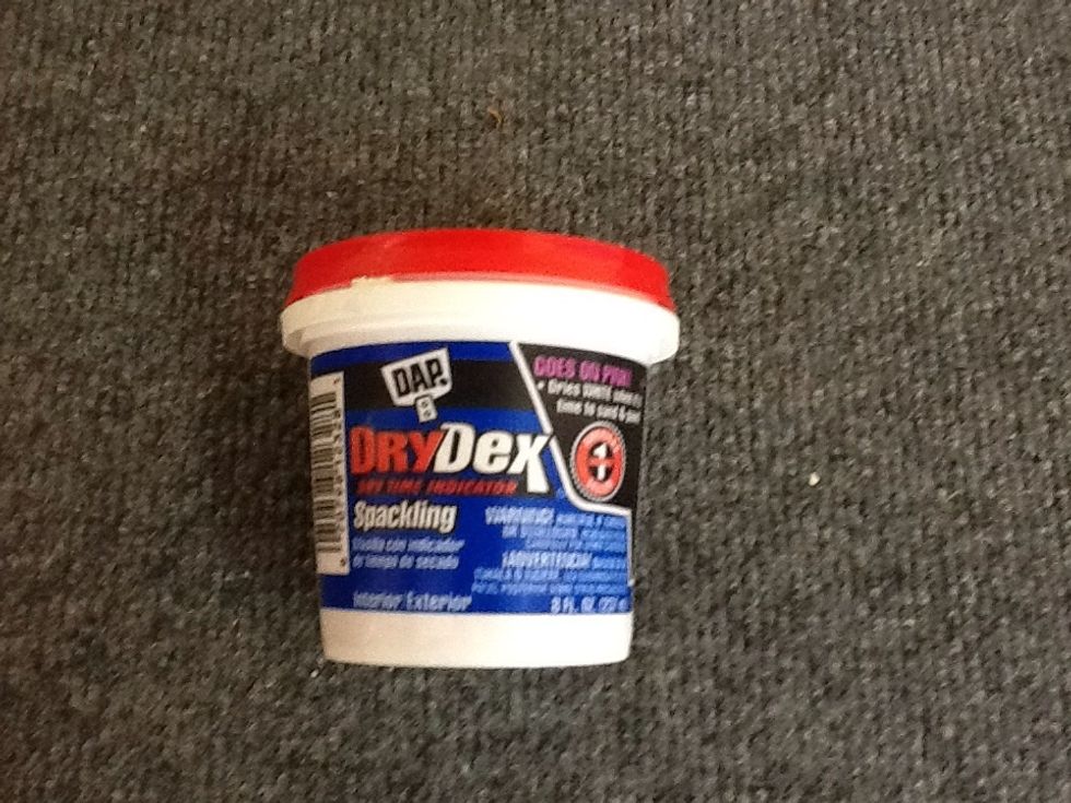 This material can fill the holes. Just dab some into the nail holes.