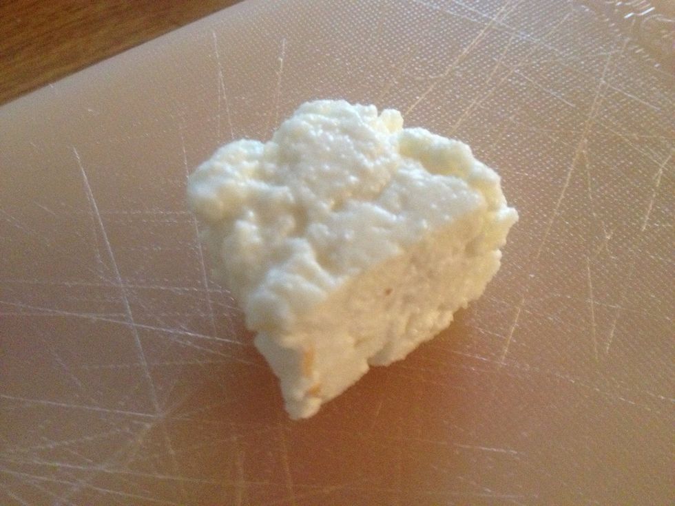 This means you can cut into chunks and marinade in Indian spices and grill. I don't think I put mine under a heavy enough pot as it was still a bit too crumbly