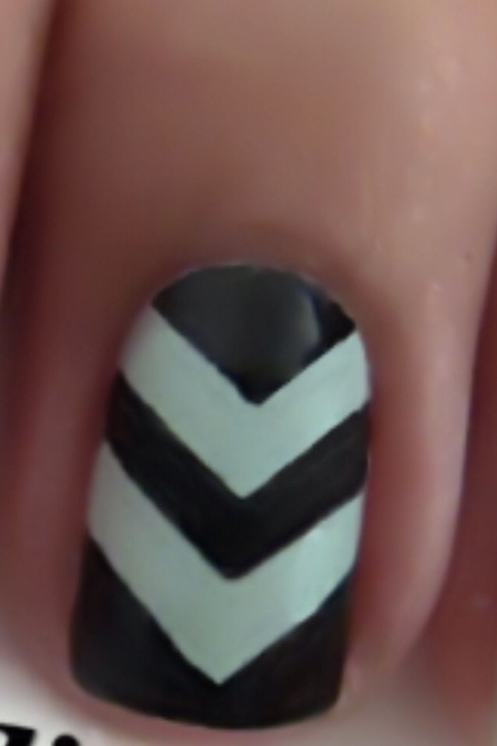 This one you need to pain nails blue than creat design with tape and paint over with black and peel off tape