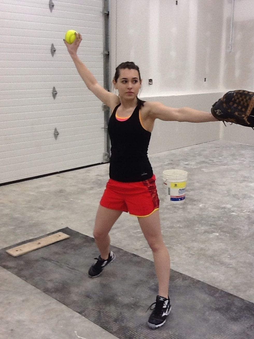 This open position, occurring in the middle of the pitch, allows you to drive with your push leg, and creates a clear path for the arm to pass by without interference from the hip.