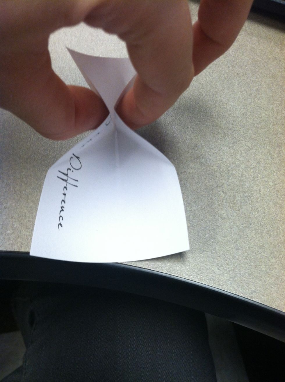 This part gets a little tricky but once you learn it it's very easy. You want to pinch together the center crease without creasing the paper again.