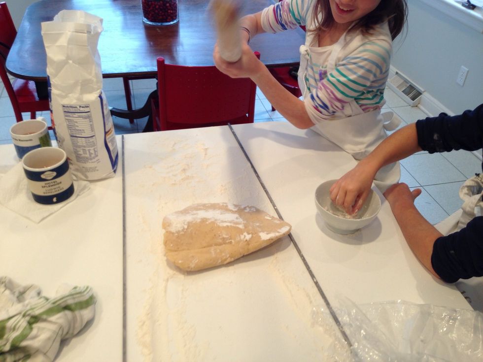 This part is fun. You need to hit the cold dough to flatten it a bit before you begin to roll. Tell people you are going to whack the dough. Some of my people are kind of jumpy.