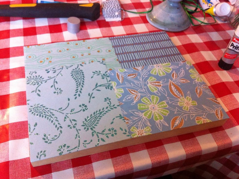 This part is optional but I decided to spruce up the wood by glueing on some scrap paper