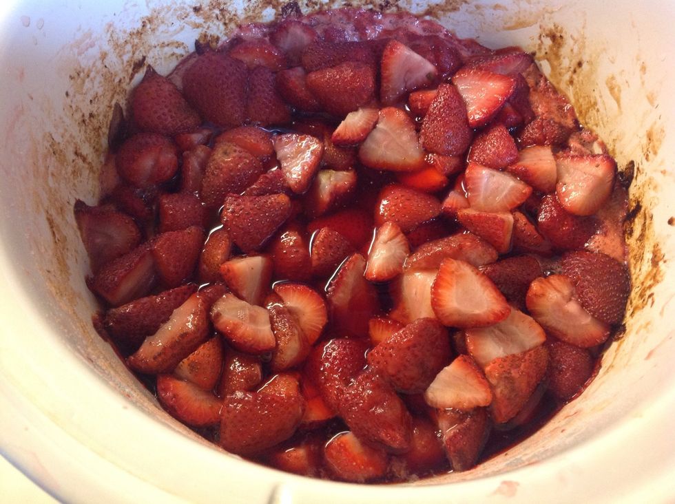 This photo was taken after one hour.  Cook for two more hours then use a potato masher to mash up the strawberries.