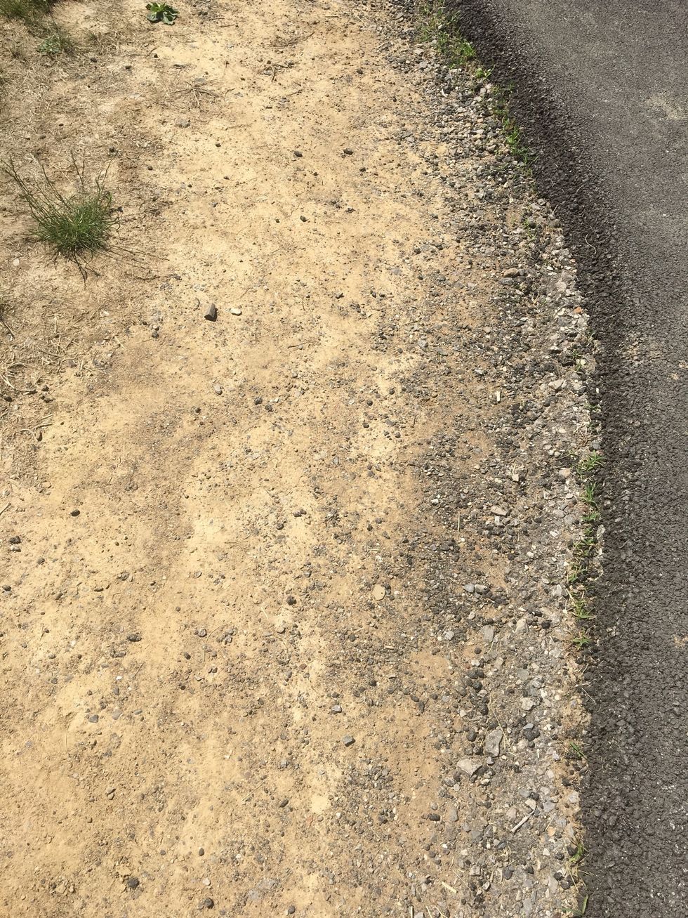 This picture is deposition. This is deposition because in the photo you can see that rocks were dropped off there. They used to be somewhere else but are now there